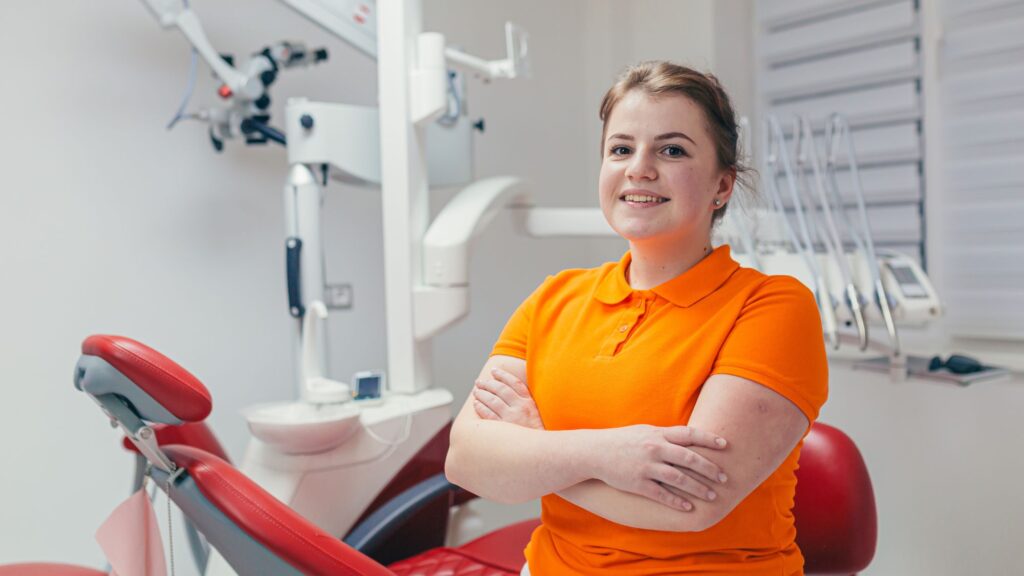 Female dentist standing while explaining how often you should visit a dentist in Livingston