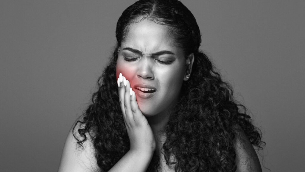 A woman suffering from a severe toothache